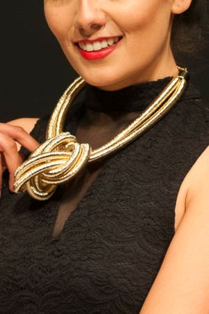 Close-up of woman posing with Gold Rope Knot necklace
