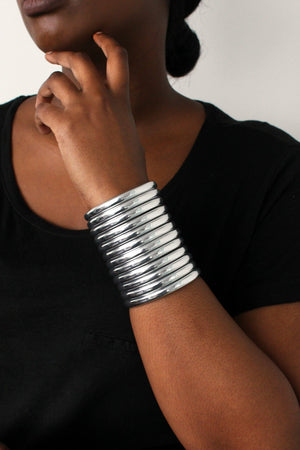 Close up of woman posing with the Silver Ndebele Cuff